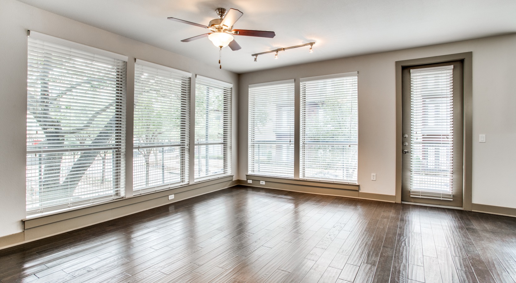 empty room with hardwood floors and ceiling fan at The Live Oak at  Branch