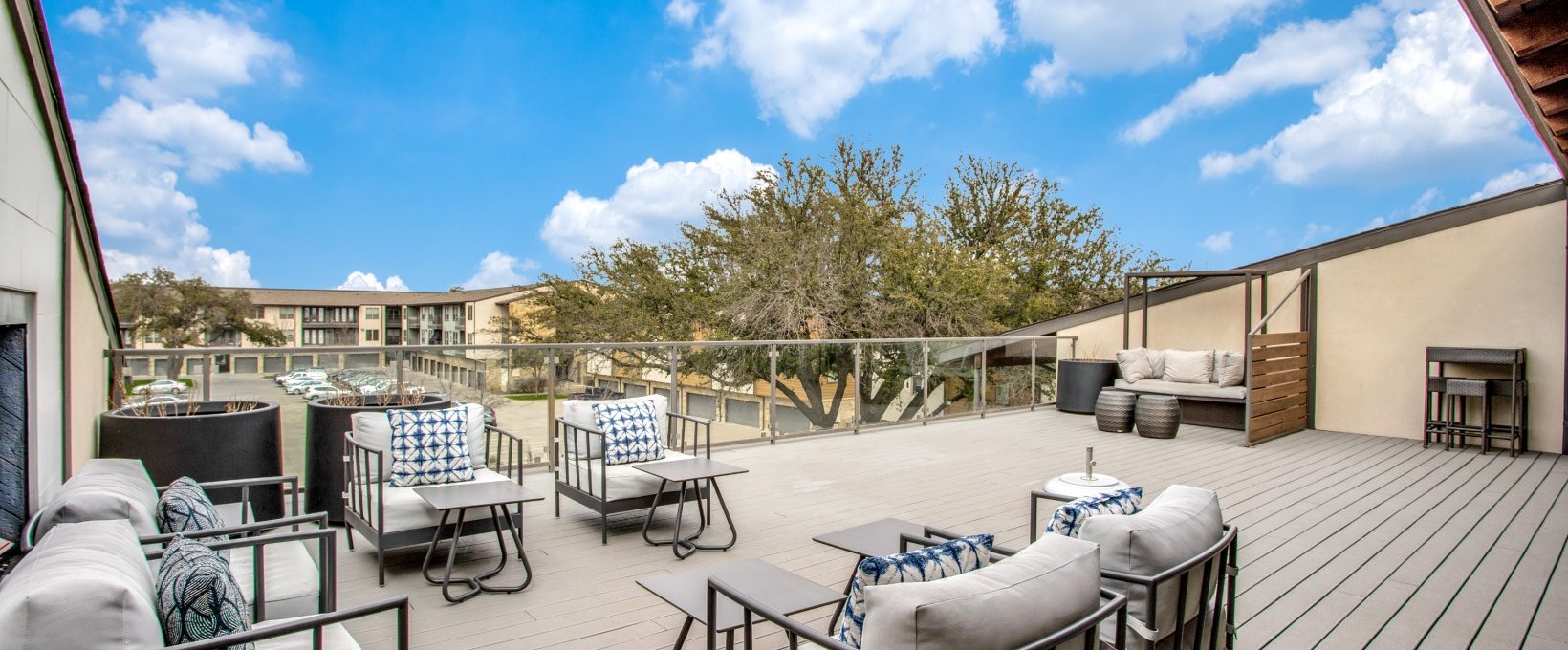 the deck has a large patio with furniture and a view of the city at The Live Oak at  Branch