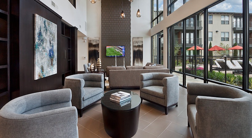 the living room features a large flat screen tv and couches at The Live Oak at  Branch