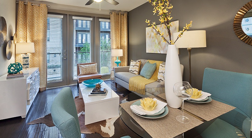 a living room with a dining area and a kitchen at The Live Oak at  Branch