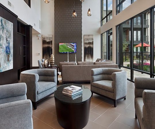 the living room features a large flat screen tv and couches at The Live Oak at  Branch
